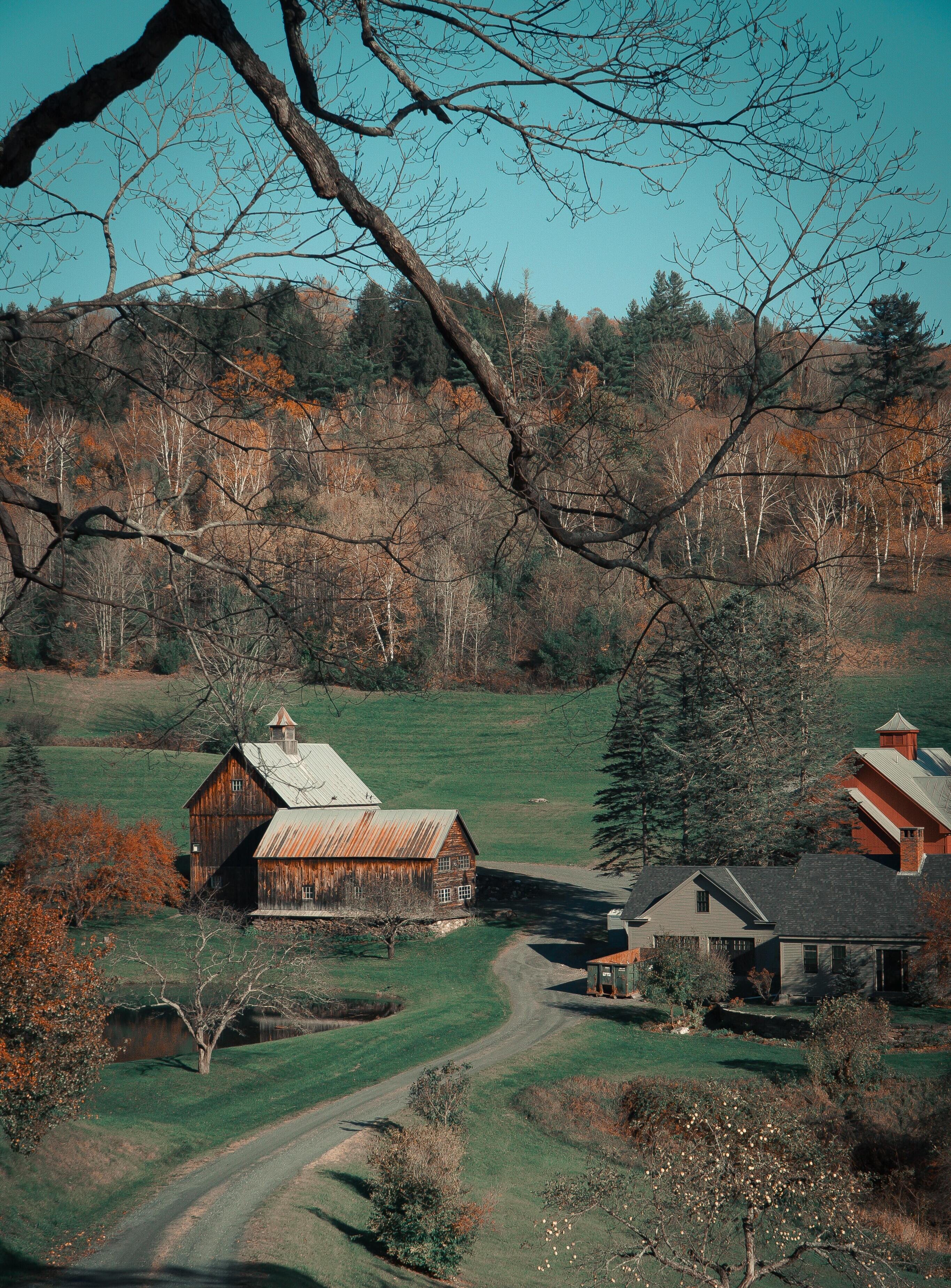 stock image of farm and mountains